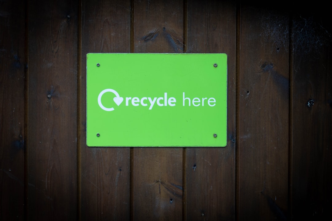Eco-friendly recycle sign on wooden wall representing sustainable choices