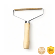 FuzzBGone™ Pro being used on fabric to remove lint and pilling